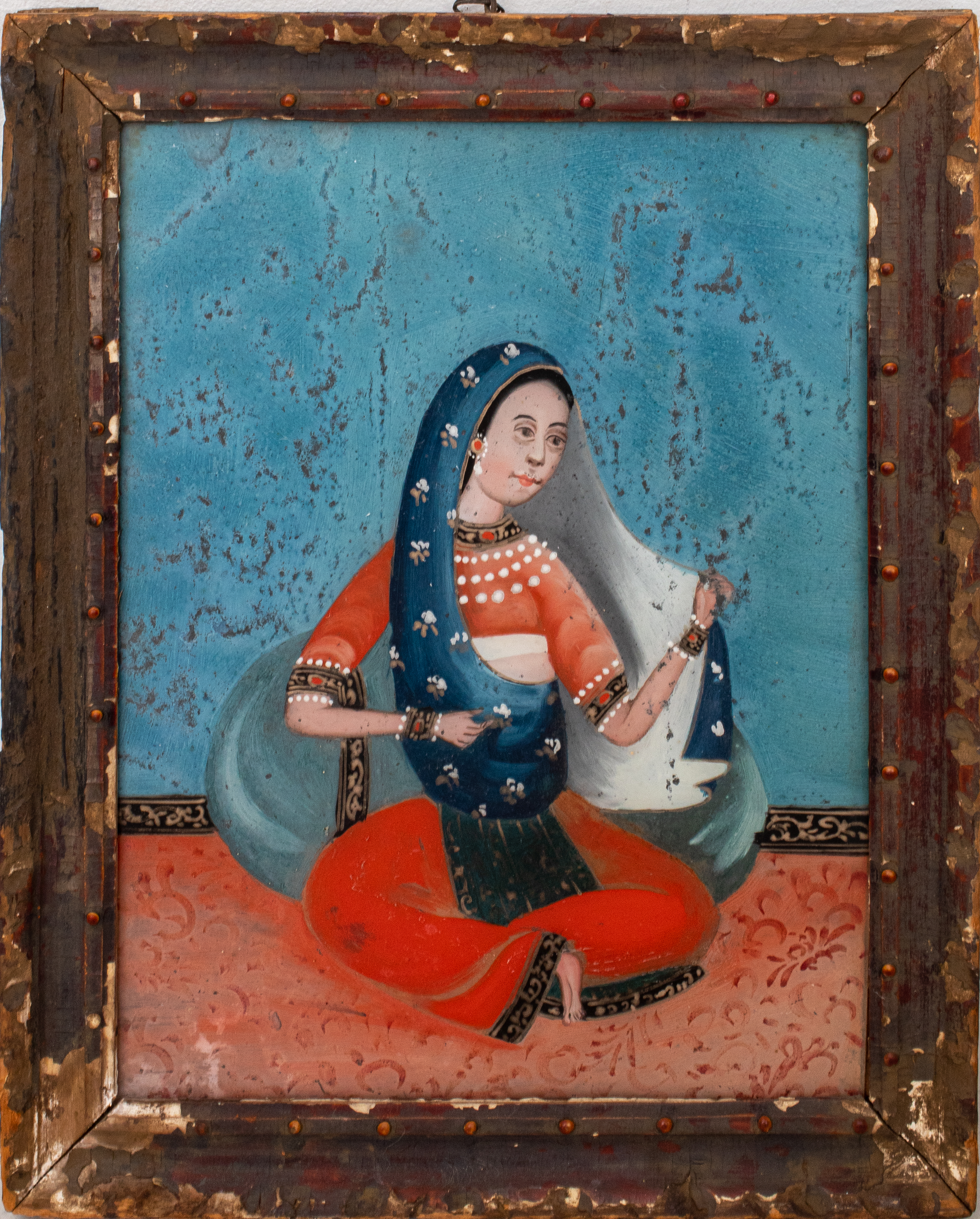 Appraisal: INDIAN REVERSE PAINTING ON GLASS OF A WOMAN Antique Indian