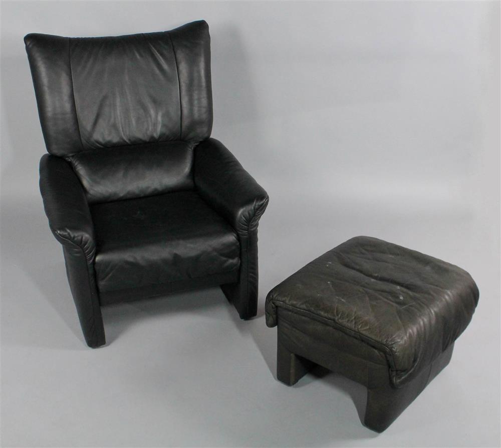 Appraisal: CONTEMPORARY BLACK LEATHER RECLINING CHAIR AND OTTOMAN having a wide