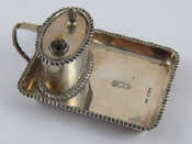 Appraisal: A silver cigar lighter the oval lighter mounted on a