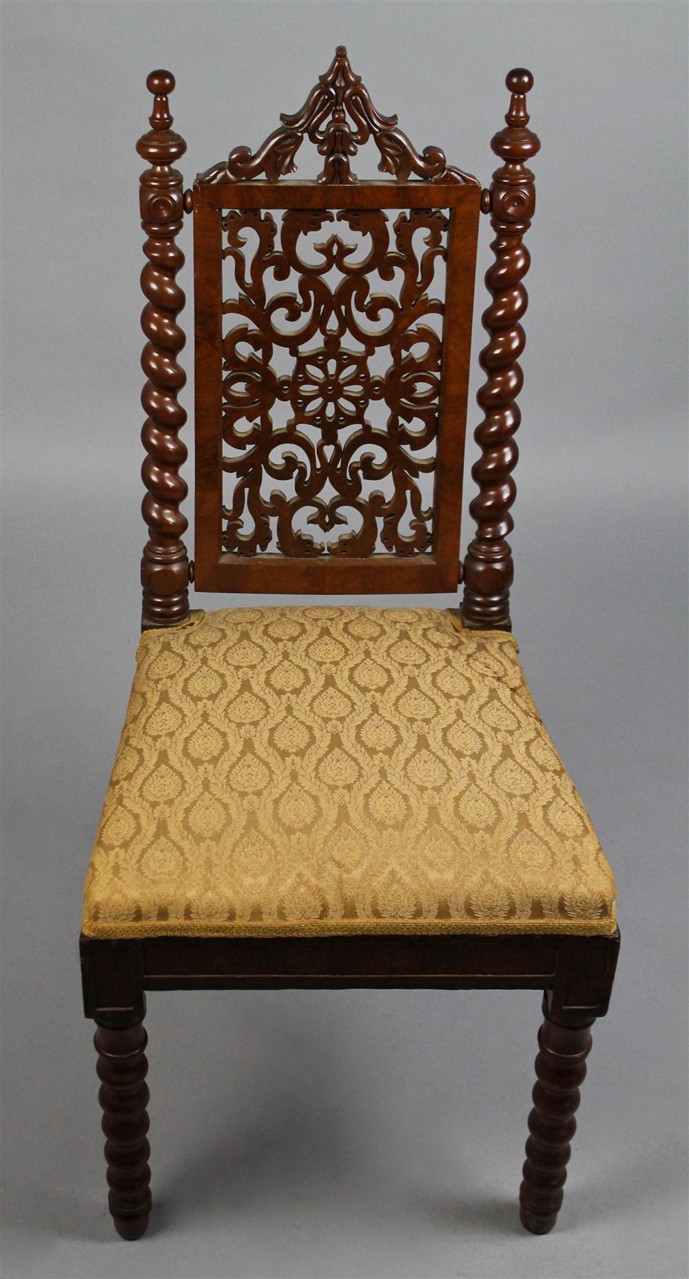 Appraisal: GOTHIC REVIVAL CARVED WALNUT SIDE CHAIR having an arched crest