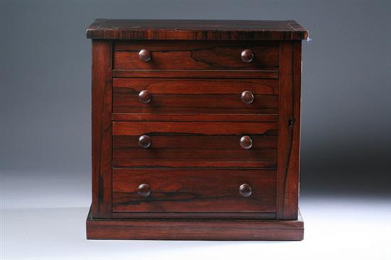 Appraisal: VICTORIAN ROSEWOOD VENEERED FOUR-DRAWER WELLINGTON JEWEL CHEST th century Rectangular