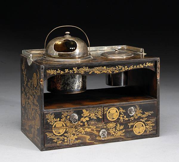 Appraisal: A gilt and black lacquer smoking set Edo Period With