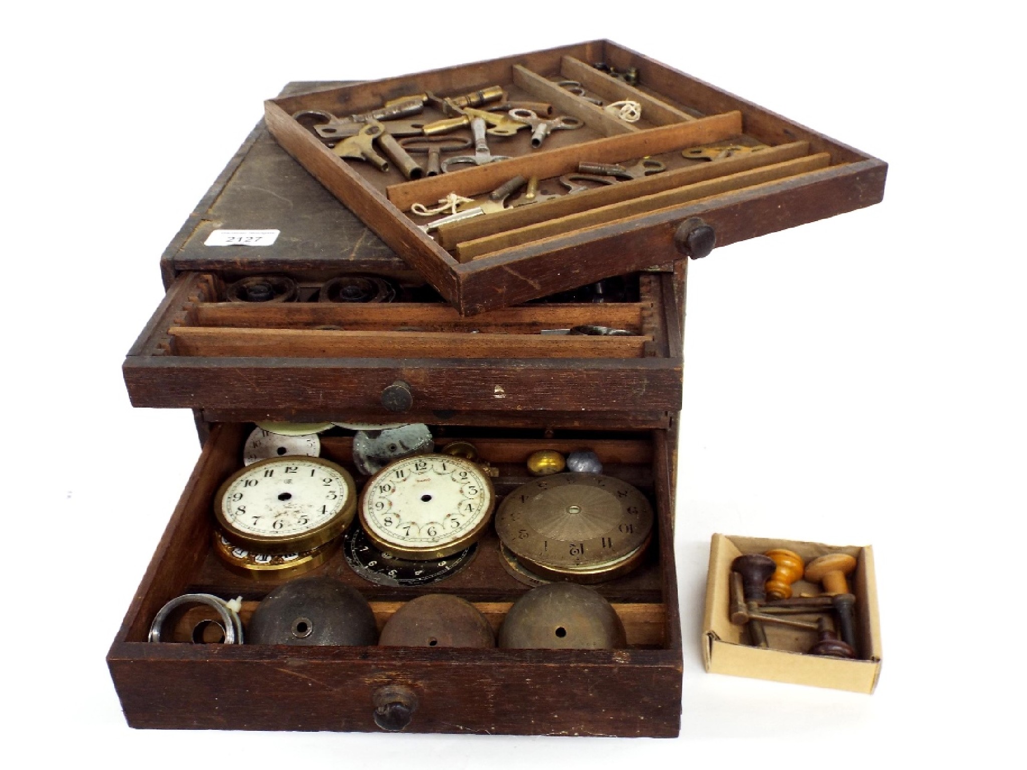 Appraisal: Wooden four drawer chest containing a quantity of various clock