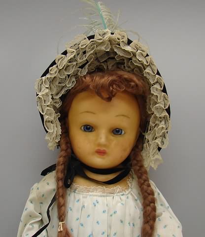 Appraisal: Unmarked wax over papier mache shoulderhead doll with stationary blue