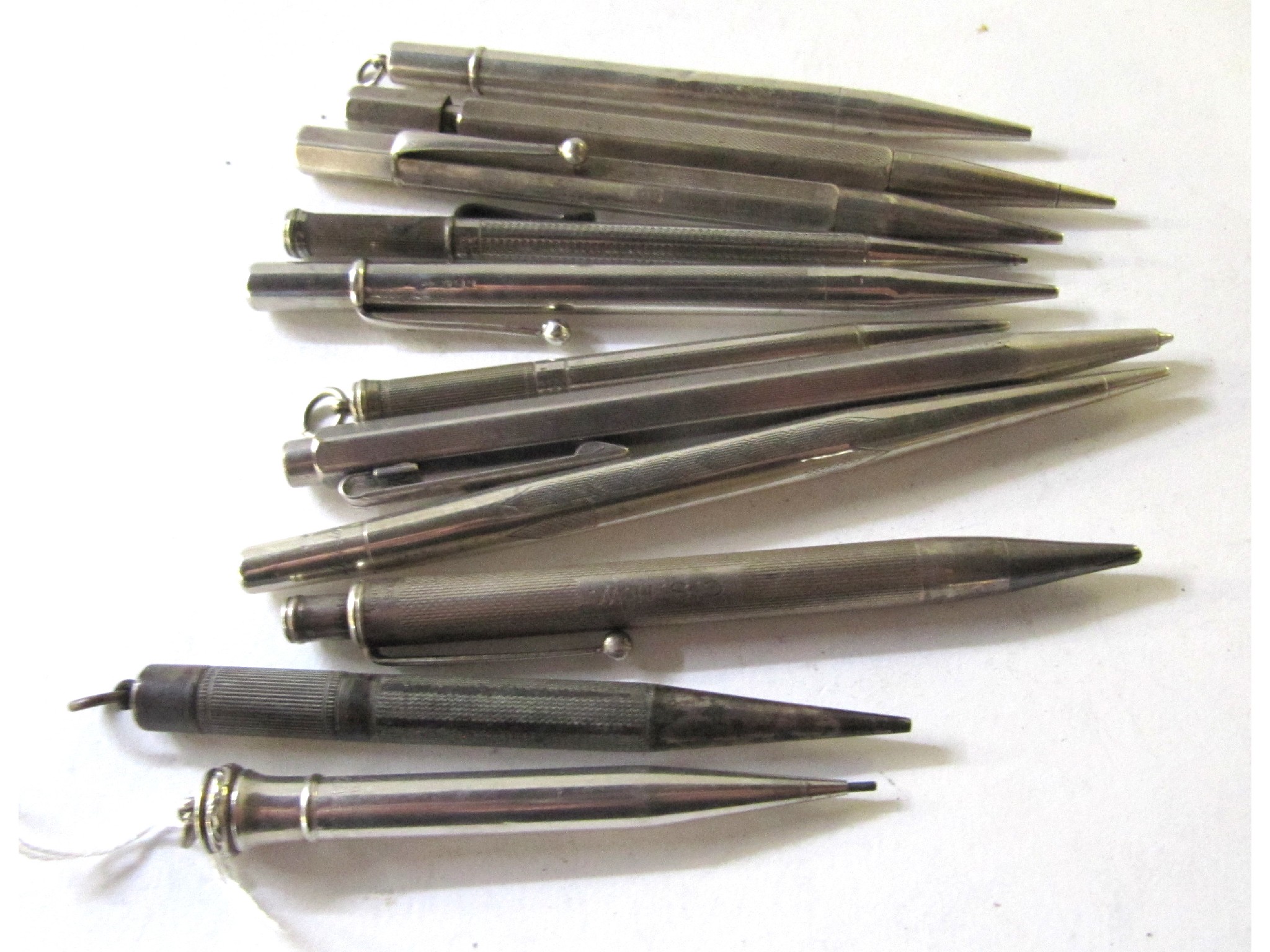 Appraisal: A lot comprising six sterling silver pencils a white metal