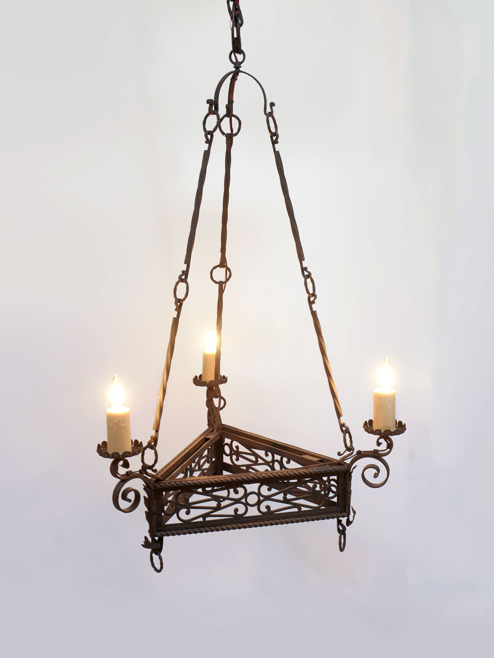 Appraisal: -LIGHT TRIANGLE WROUGHT IRON CHANDELIER -light wrought iron chandelier having