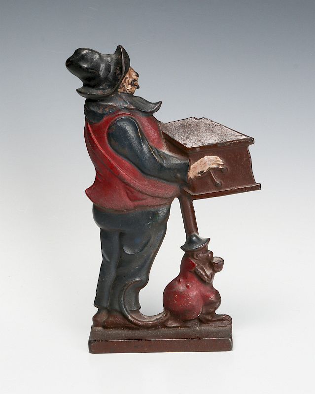 Appraisal: CAST IRON MONKEY AND ORGAN GRINDER DOOR STOP A good