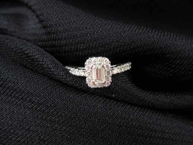 Appraisal: Diamond Ring emerald cut surrounded by diamonds totaling another carat