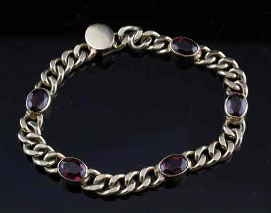 Appraisal: A garnet set gold curblink bracelet ins tests in excess