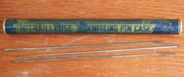 Appraisal: A th Century tin advertising knitting needle case containing knitting