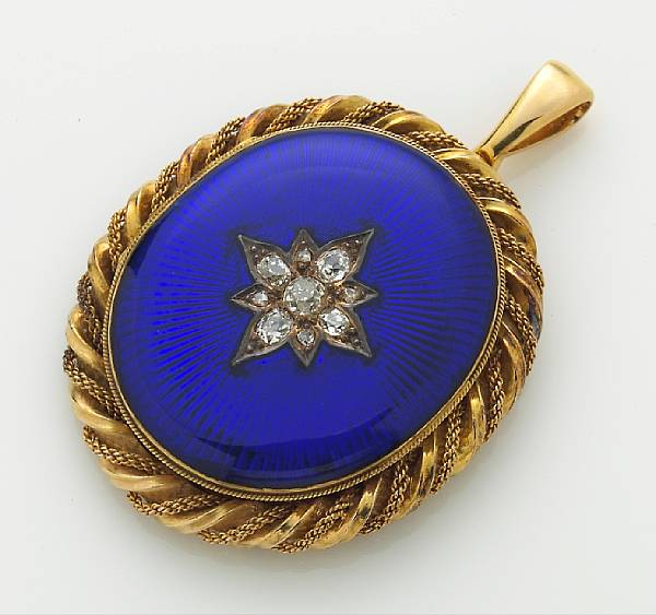 Appraisal: A diamond and enamel locket opening to reveal a hand