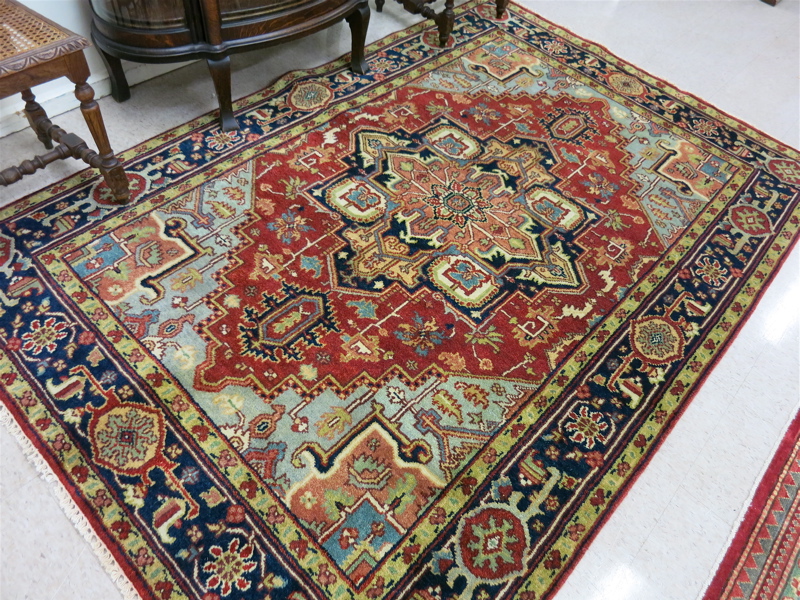 Appraisal: HAND KNOTTED ORIENTAL CARPET Persian Serapi design featuring a large