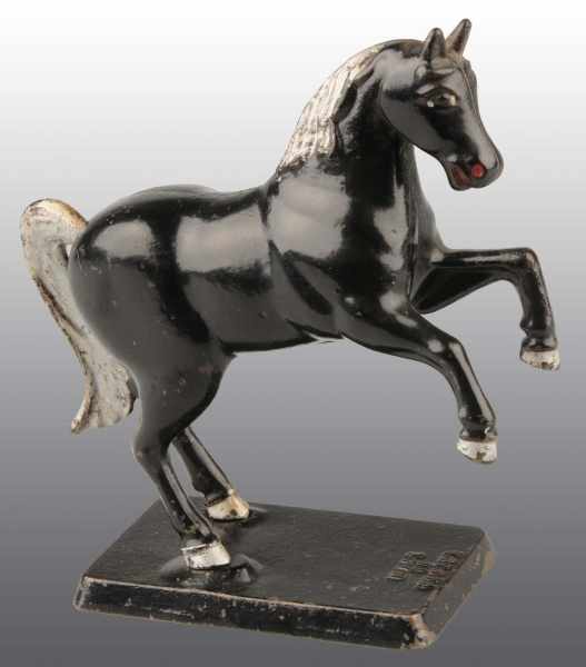 Appraisal: Cast Iron Prancing Horse Still Bank Description Marked Made in