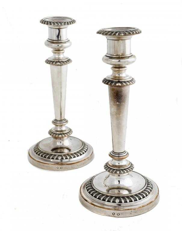 Appraisal: A PAIR OF OLD SHEFFIELD PLATE CANDLESTICKS the nozzle in