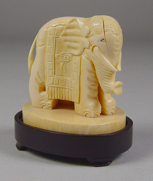 Appraisal: Carved Ivory Elephant on Stand Circa 's Carved elephant with