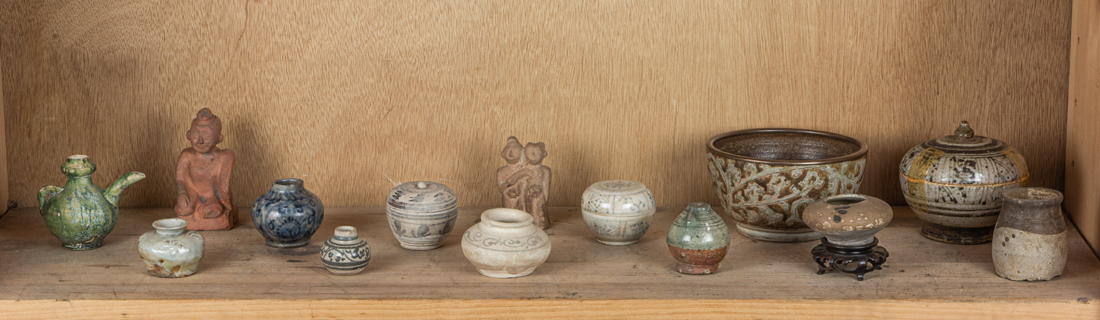 Appraisal: SHELF OF SOUTHEAST ASIAN CERAMIC JARLETS AND VARIOUS CERAMIC ITEMS