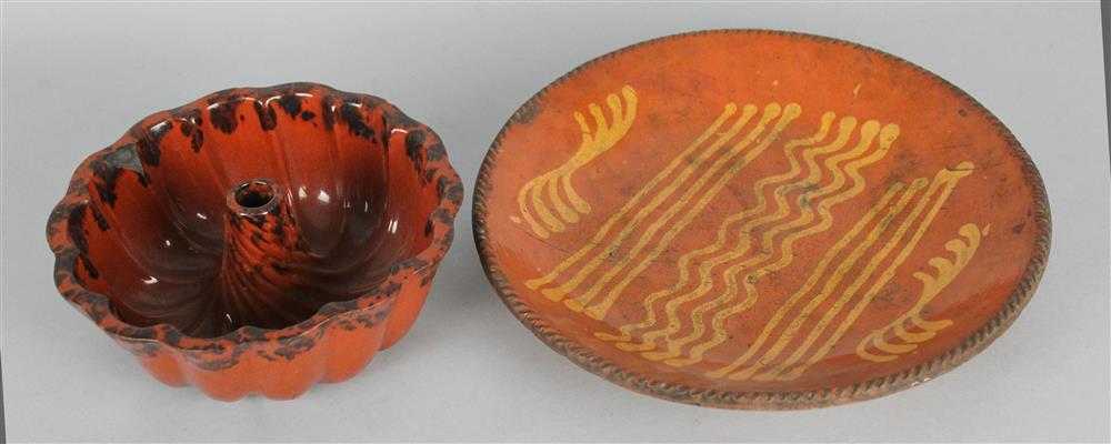 Appraisal: TWO REDWARE POTTERY PIECES including a circular dish with applied