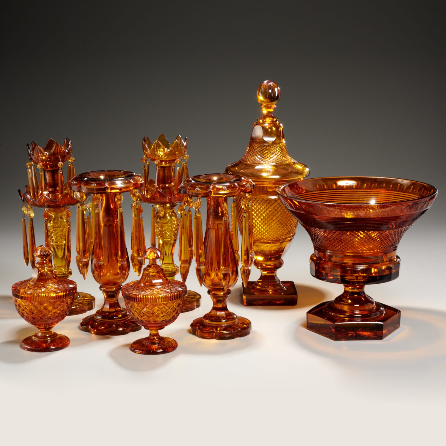 Appraisal: ELEGANT COLLECTION AMBER CUT GLASS th c pieces incl a