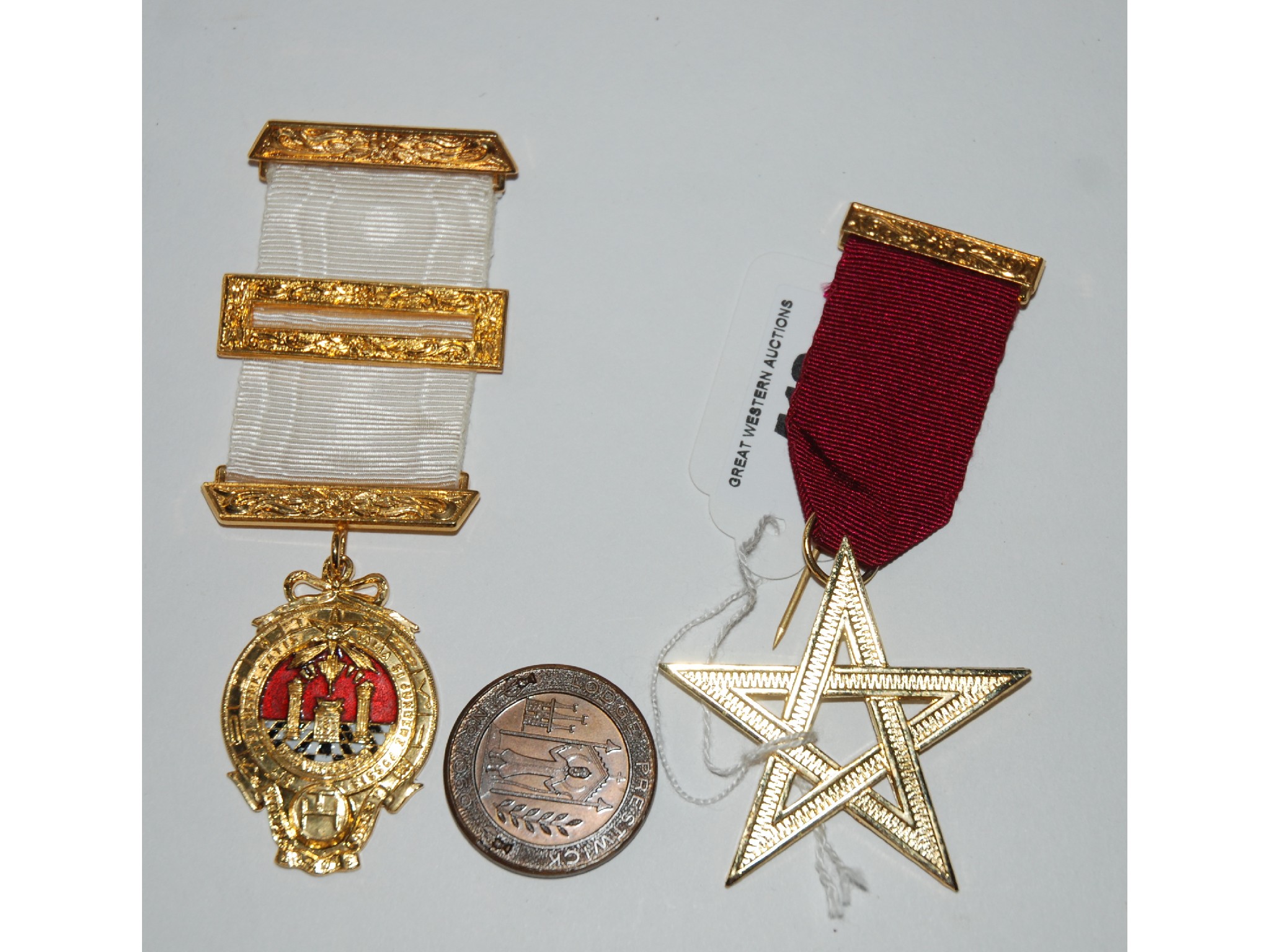 Appraisal: A collection of Masonic memorabilia including yellow-metal medal aprons case