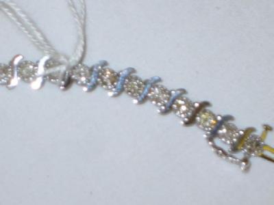 Appraisal: A DIAMOND TENNIS BRACELET comprising brilliant cut diamonds claw set