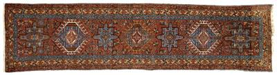 Appraisal: Heriz runner seven central medallions on red brown field ft