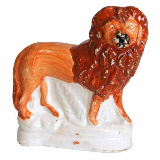 Appraisal: An English Victorian Staffordshire Pottery Lion circa the standing russet