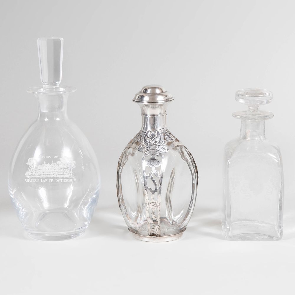 Appraisal: Two Glass Decanters and Stoppers and a Mexican Silver-Mounted Glass