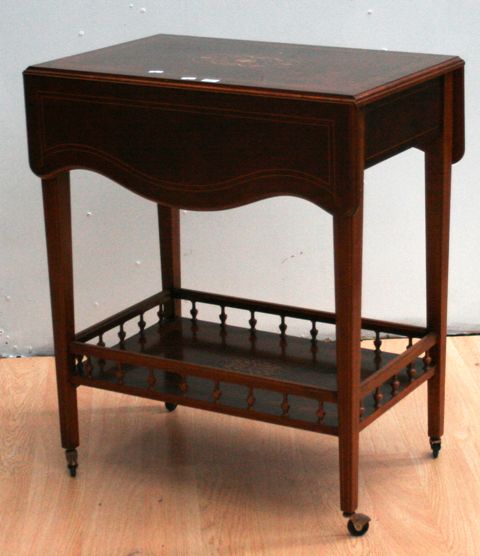 Appraisal: A walnut veneer and inlaid reproduction tea trolley damage cms