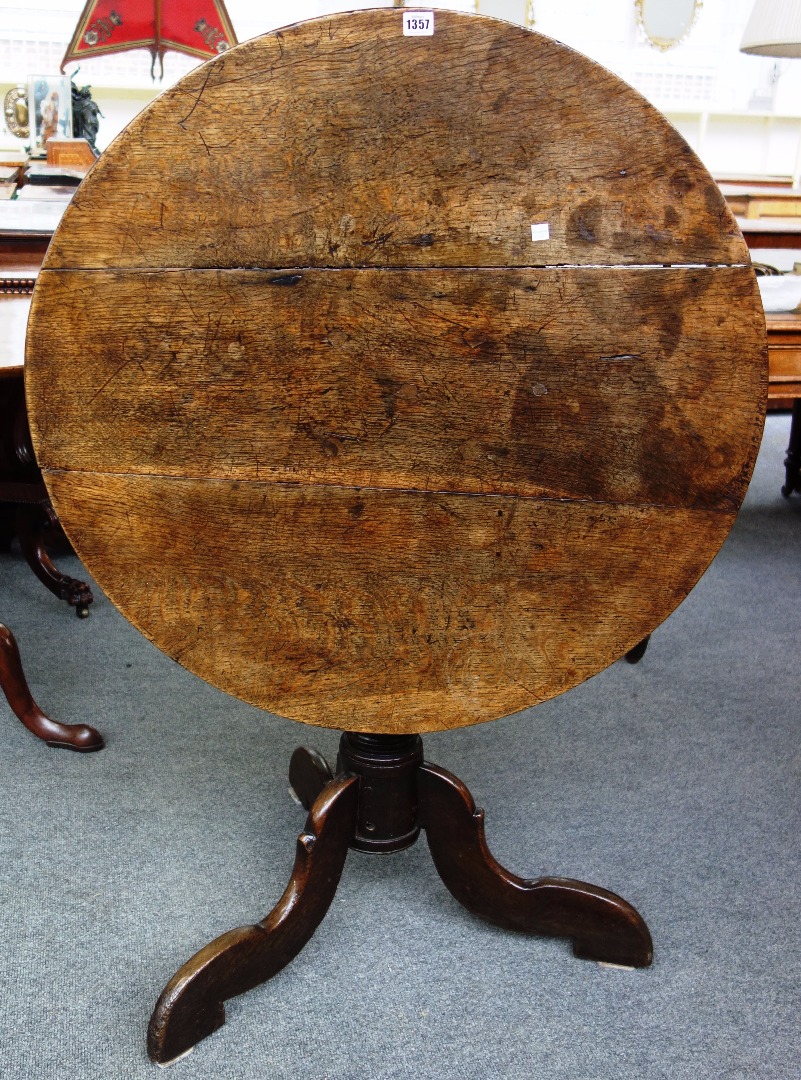 Appraisal: A made up th century oak circular snap top occasional