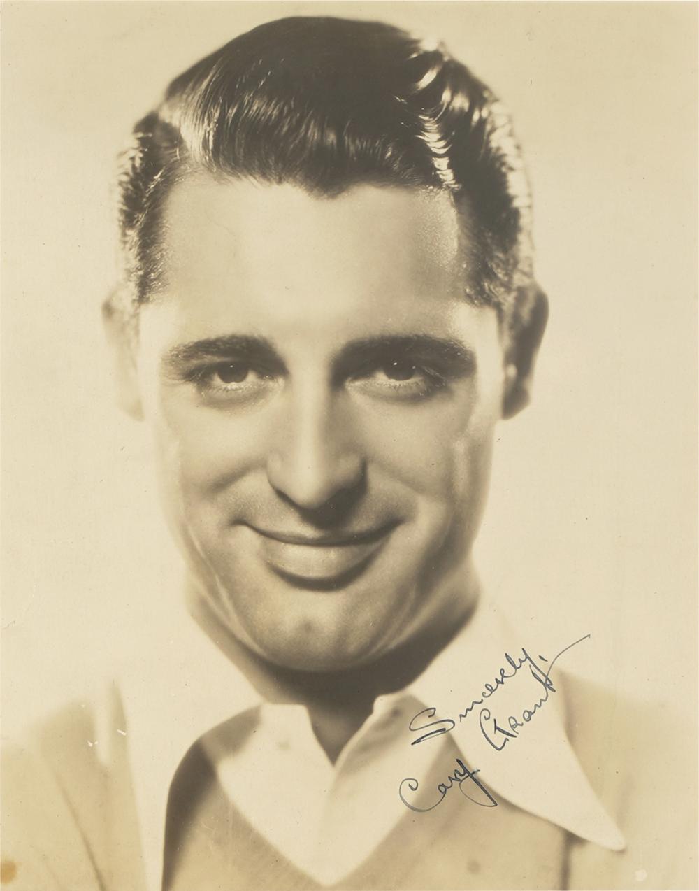 Appraisal: PHOTO OF CARY GRANTmatted and framed under acrylic secretarial signature