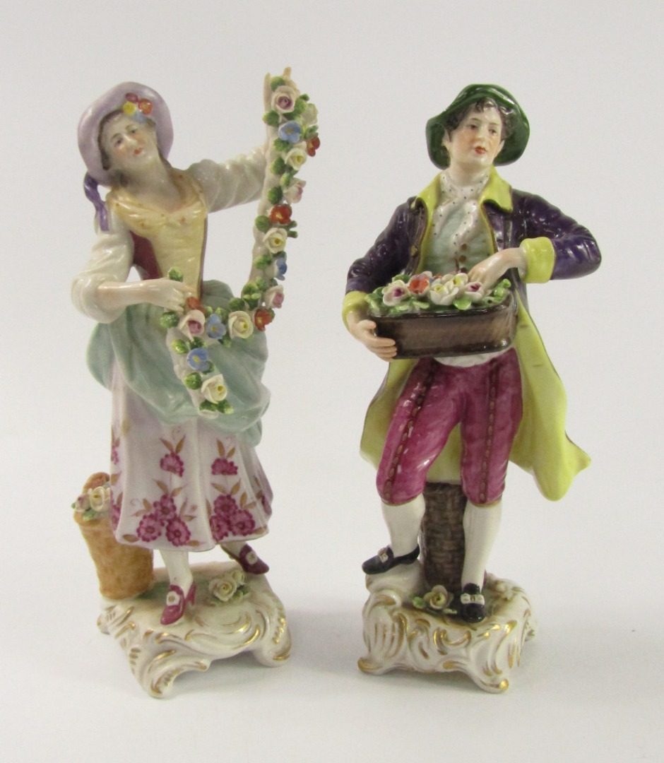 Appraisal: A pair of thC Volkstedt porcelain figures of a gentleman