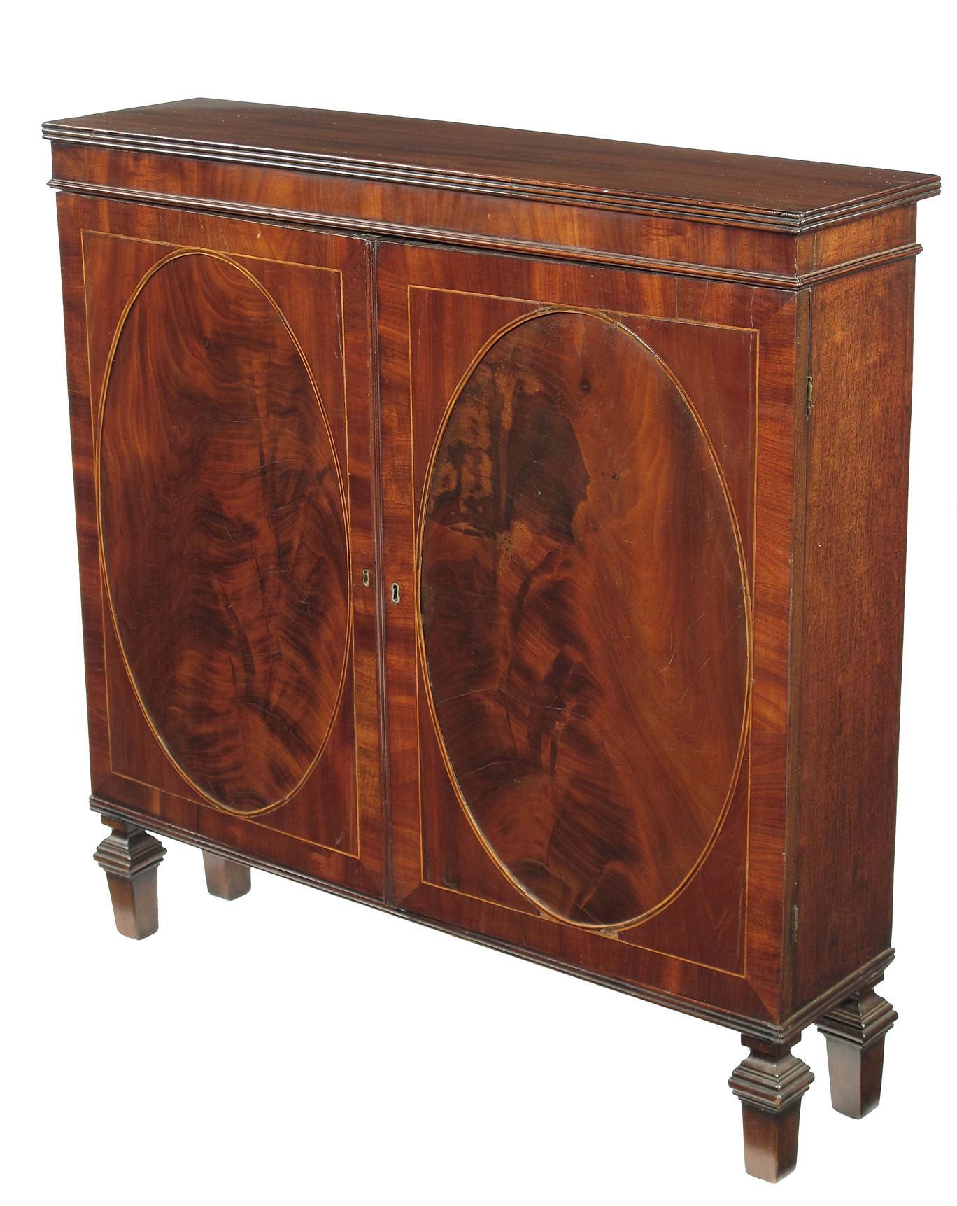 Appraisal: A mahogany cabinet of narrow proportions