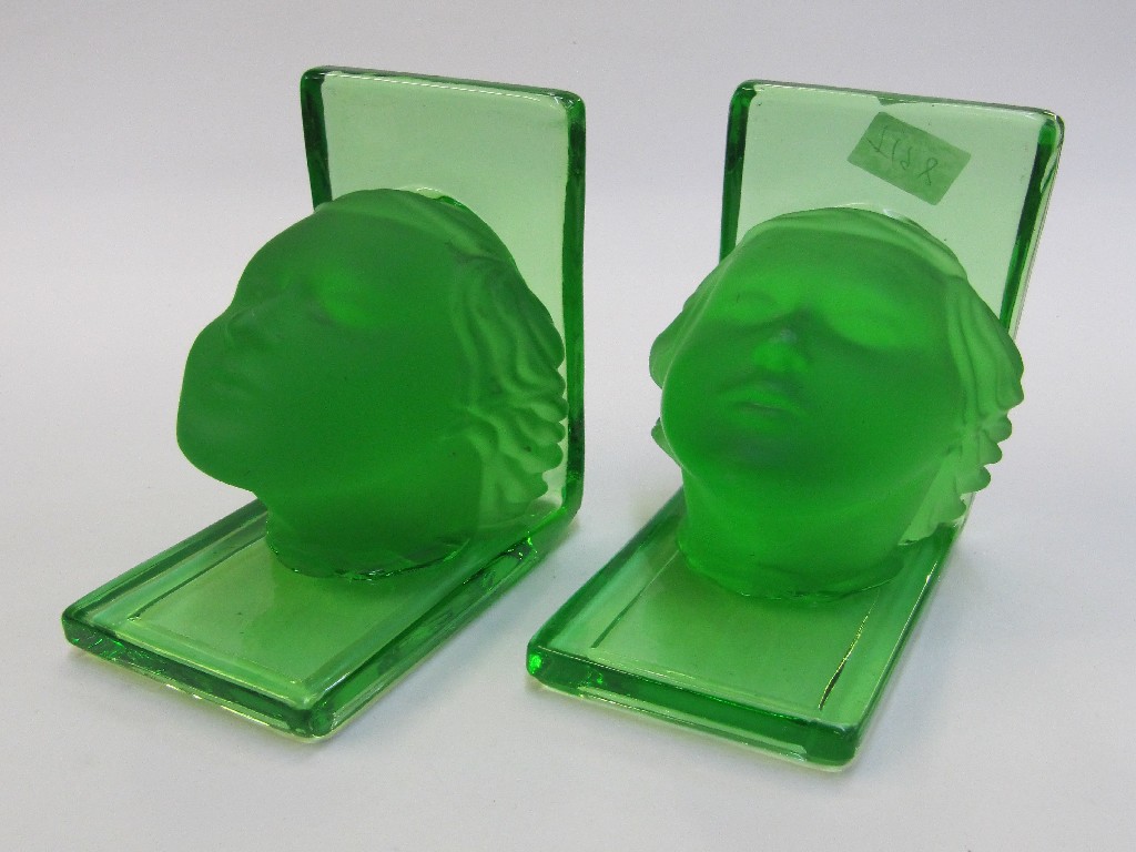 Appraisal: Pair of Art Deco green glass bookends modelled with women's