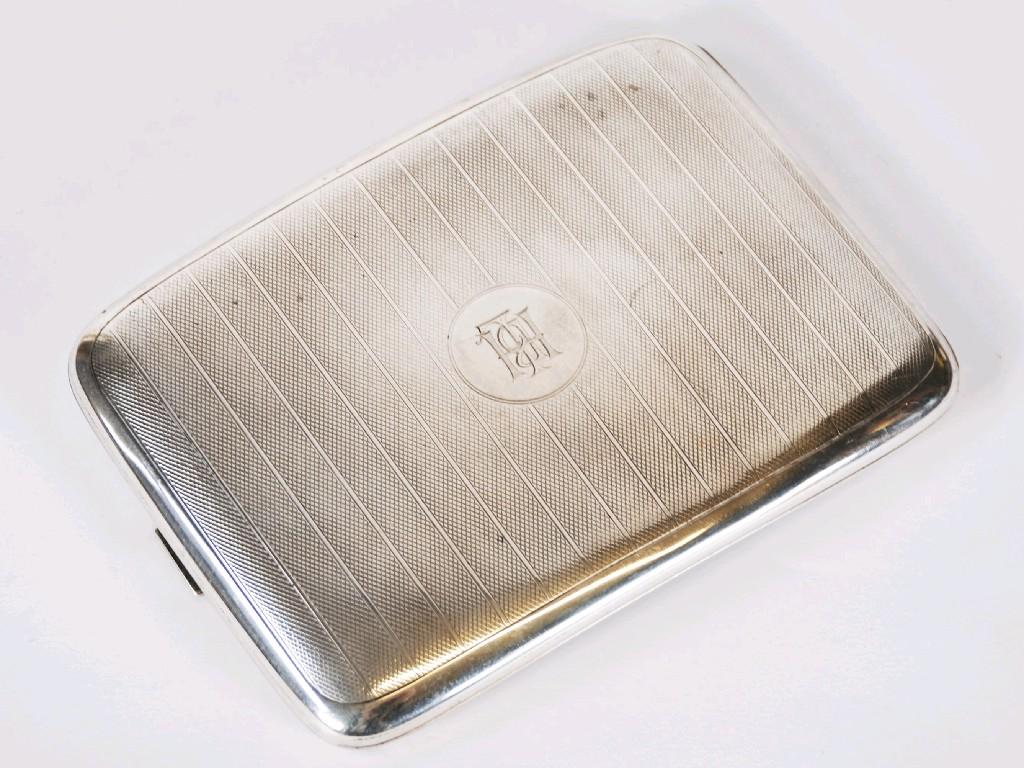 Appraisal: SILVER CURVED OBLONG POCKET CIGARETTE CASE with striped engine turned