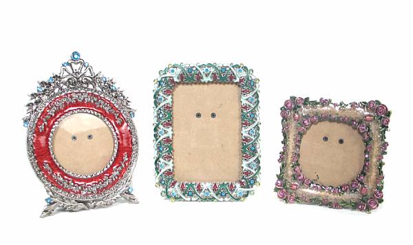 Appraisal: A group of five enamel and jewel decorated picture frames