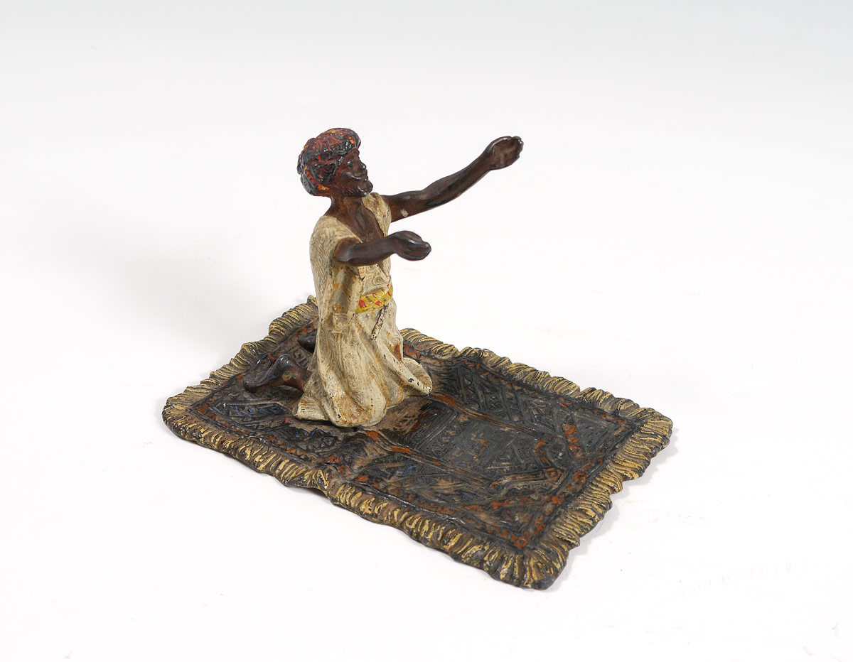 Appraisal: BERGMAN STYLE COLD PAINTED ARAB ON CARPET BRONZE Orientalist figure