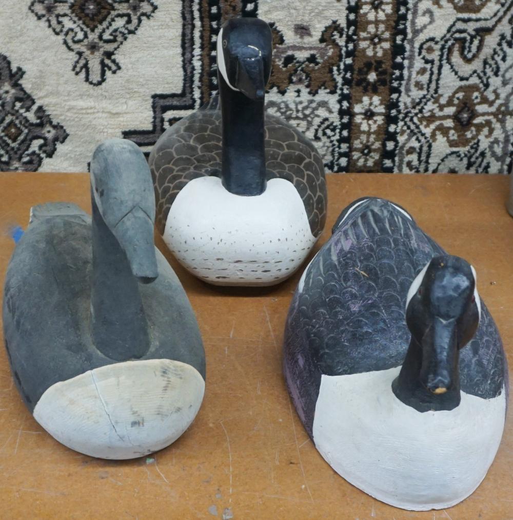 Appraisal: TWO CARVED AND DECORATED WOOD AND ONE PLASTER GEESE DECOYS