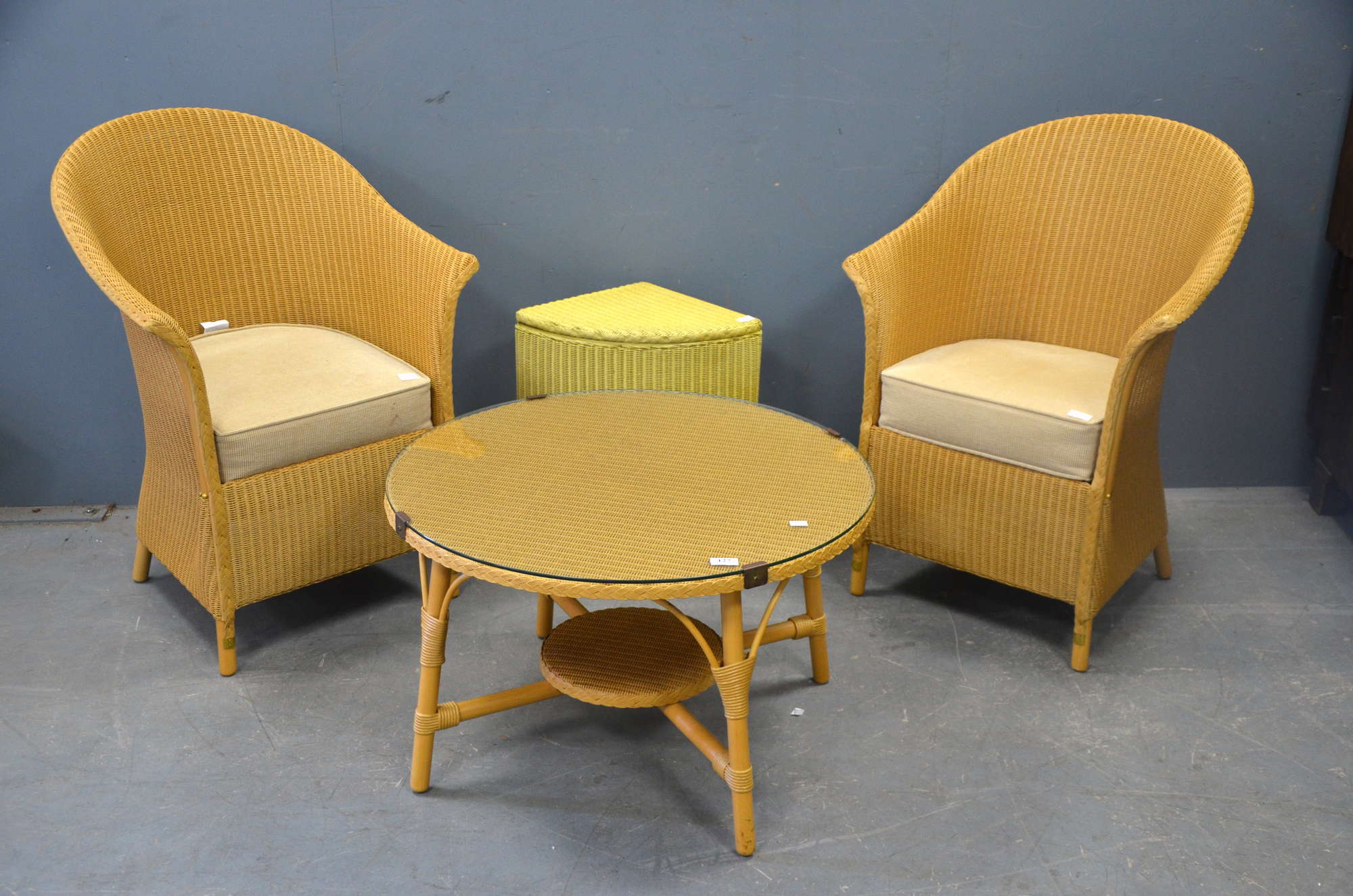 Appraisal: Two Lloyd loom chairs a table and a linen basket