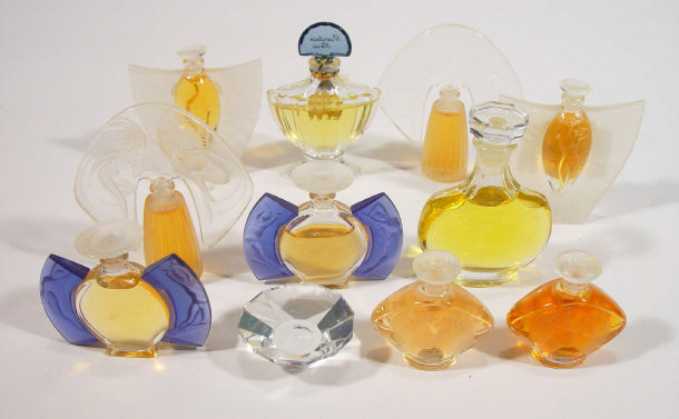 Appraisal: Eleven Lalique glass and moulded composite scent bottles with figural