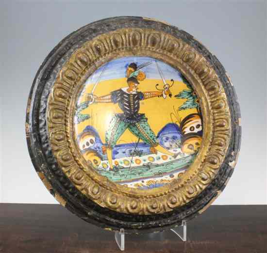 Appraisal: A Montelupo dish th century decorated with a swordsman in