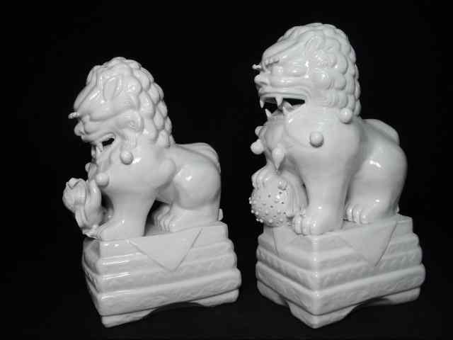 Appraisal: Two Chinese blanc de chine porcelain foo dogs Unmarked glazed