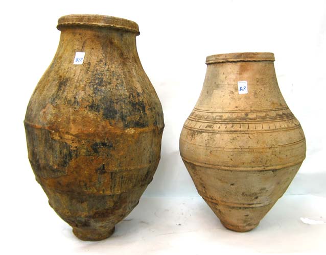 Appraisal: TWO EARLY TURKISH CLAY POTTERY OIL JARS heights and inches