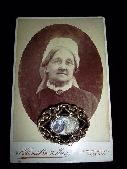 Appraisal: A Victorian gold framed mourning brooch the scrolling frame to