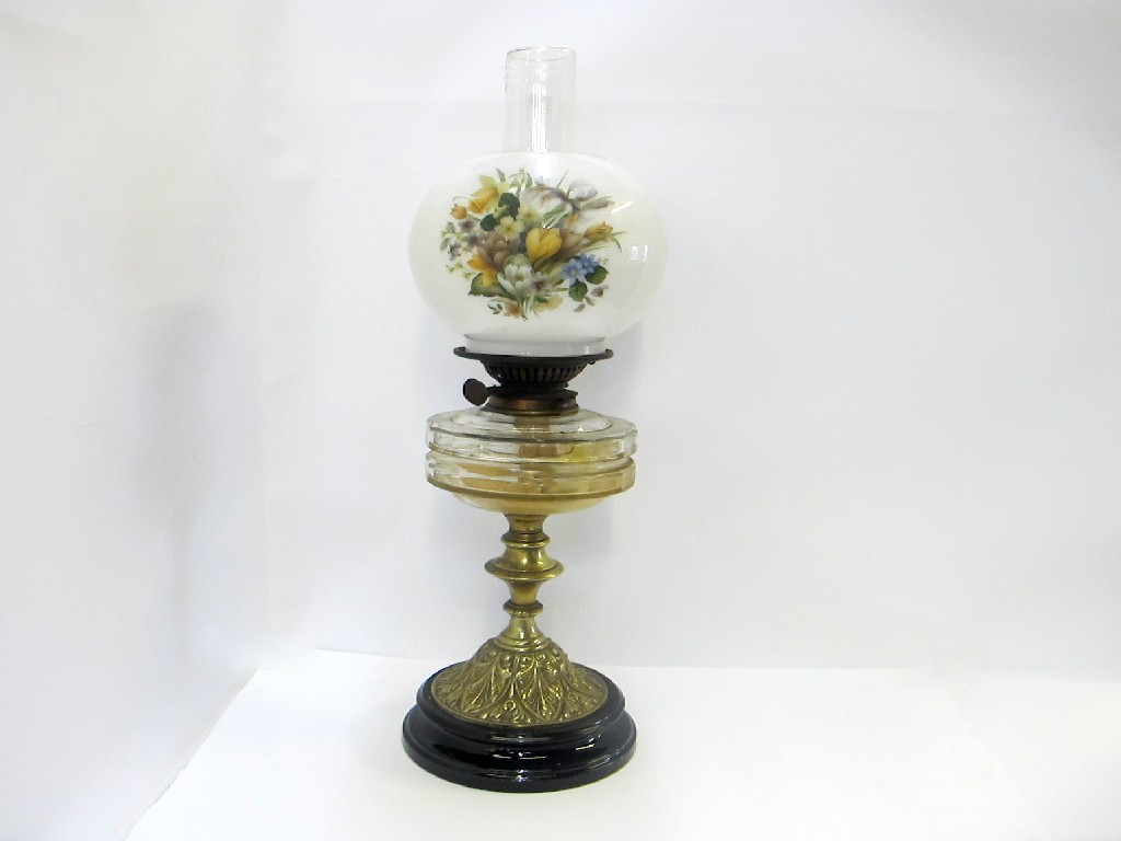 Appraisal: Paraffin lamp with flower decorated glass shade