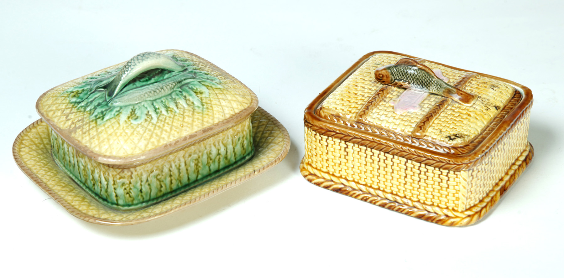 Appraisal: TWO MAJOLICA COVERED SARDINE DISHES England nd half- th century