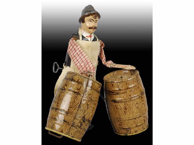 Appraisal: French Martin Tin Man with Barrels Toy Description Wind-up Workman