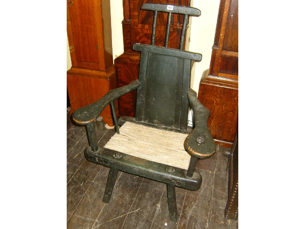 Appraisal: An th century primitive oak elbow chair probably Welsh with