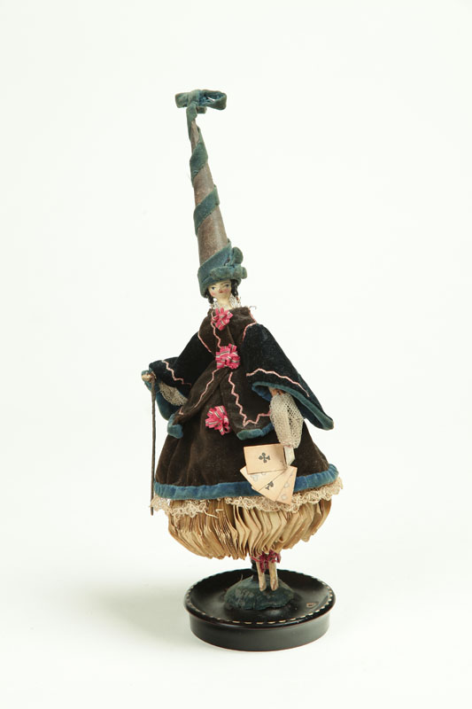 Appraisal: FORTUNE TELLER DOLL France th century paper and fabric Velvet