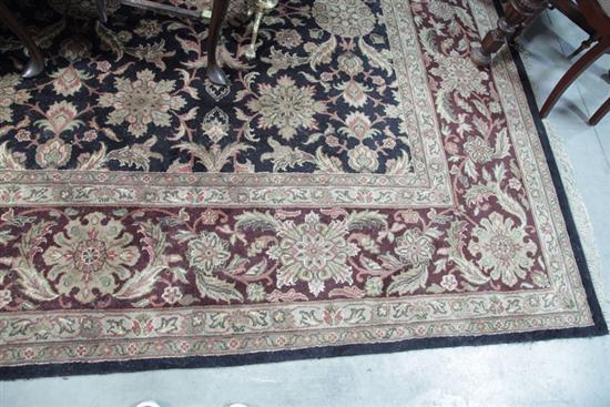 Appraisal: ROOM SIZE RUG Black field having multiple tan and maroon