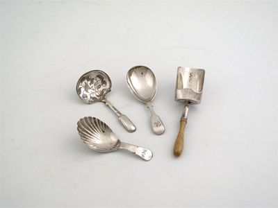 Appraisal: Four caddy spoons a George III bone handled scoop London